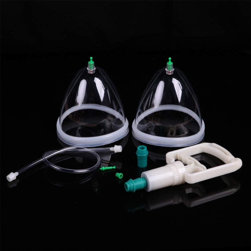 Two clear cupping devices with attachments on a black background