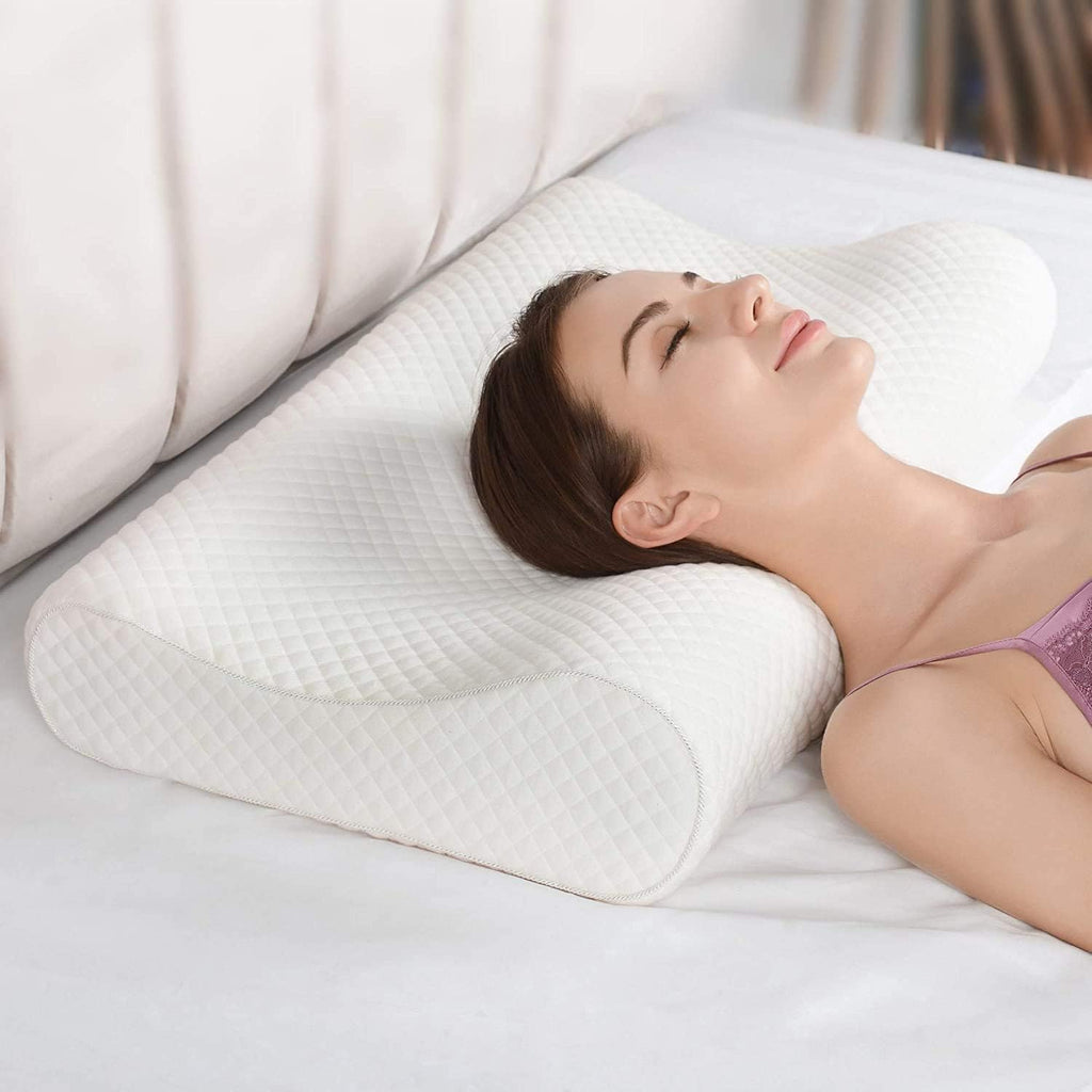 Woman lying on a white pillow with a blurred background