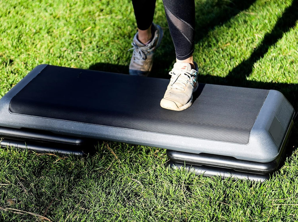 Step platform being used outdoors on grass